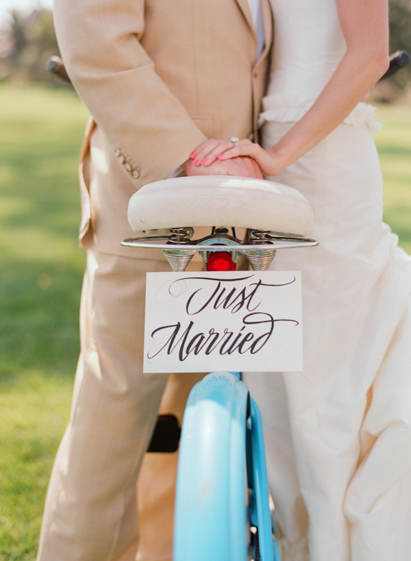 bride and groom with bicycle wedding photo by Elizabeth Messina Photography